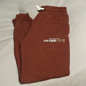 Used Gymshark sweat pants, size Small in brown color.